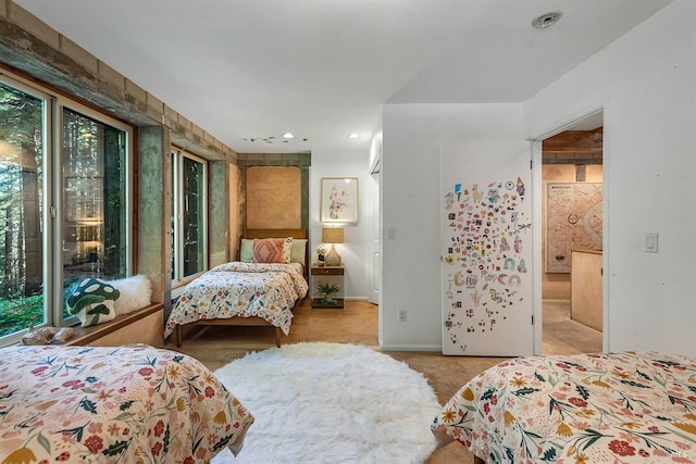 bedroom featuring light colored carpet