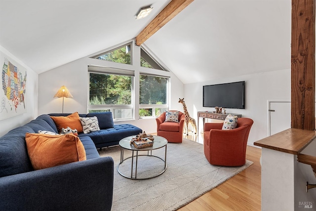 living room featuring lofted ceiling with beams and wood-type flooring