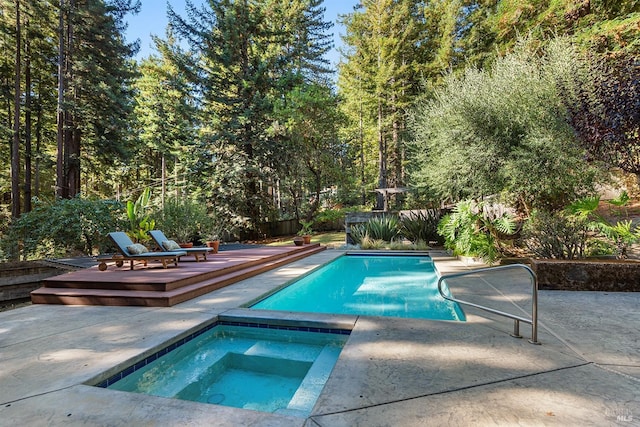 view of pool featuring an in ground hot tub and a patio area