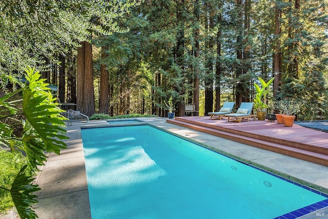 view of swimming pool featuring a deck