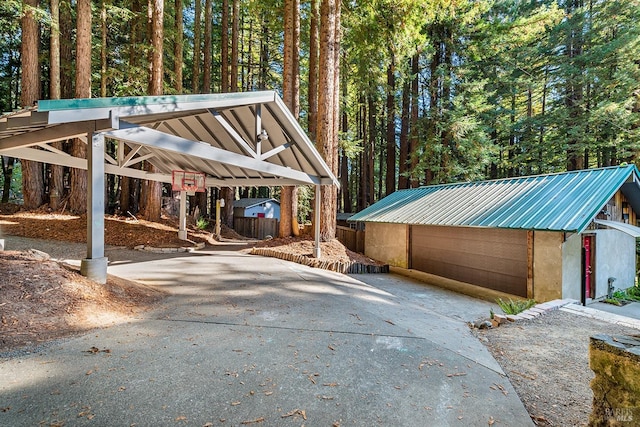 view of parking / parking lot featuring a carport