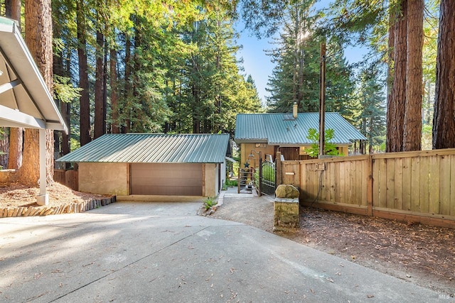 view of front of property with an outbuilding and a garage