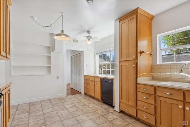 kitchen with ceiling fan, dishwasher, sink, and a healthy amount of sunlight