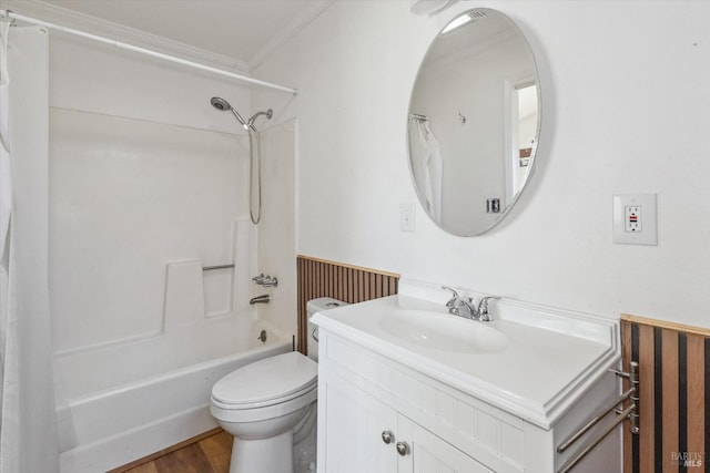 full bathroom featuring wood-type flooring, ornamental molding, shower / tub combo with curtain, vanity, and toilet