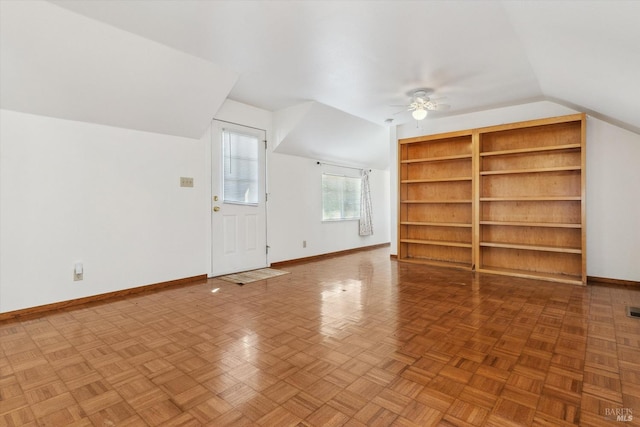 bonus room featuring parquet flooring, lofted ceiling, and ceiling fan