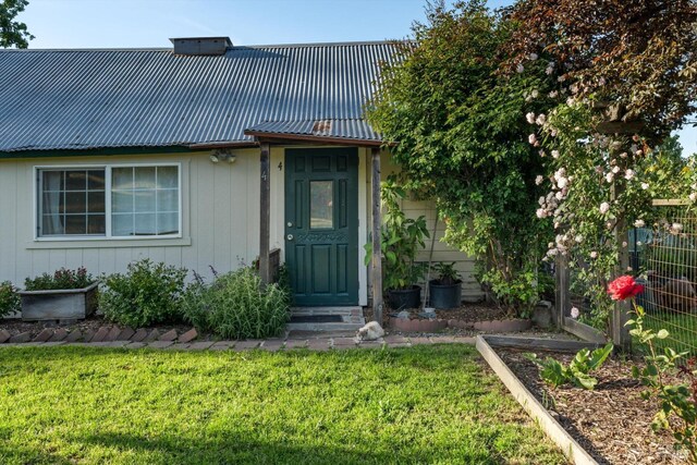 4344 Langner Ave, Santa Rosa, CA 95407 - doorway to property featuring a yard, metal roof, and fence
