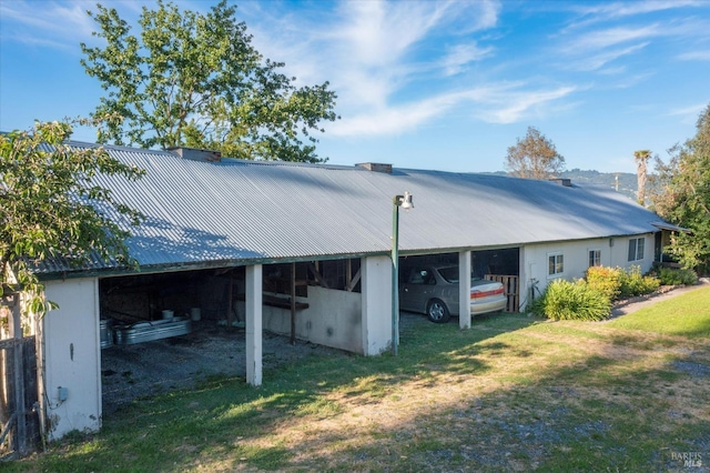 4344 Langner Ave, Santa Rosa, CA 95407 - back of house with metal roof, a carport, a yard, and a chimney