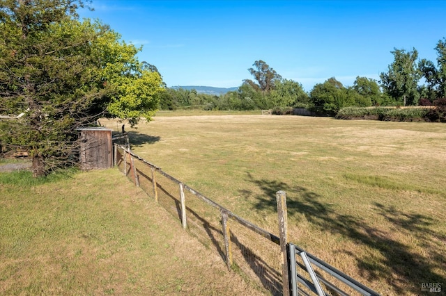 view of yard with a rural view