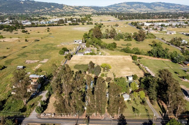 bird's eye view featuring a rural view and a mountain view