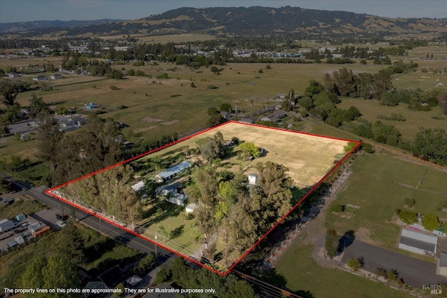 birds eye view of property featuring a rural view