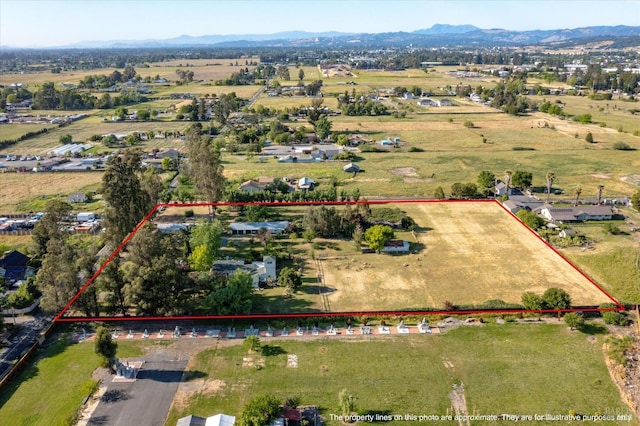 bird's eye view featuring a mountain view and a rural view