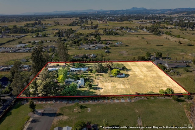 bird's eye view with a mountain view and a rural view