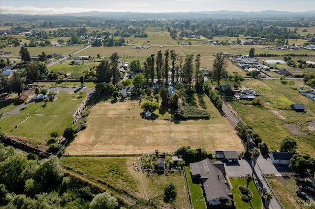 birds eye view of property featuring a rural view