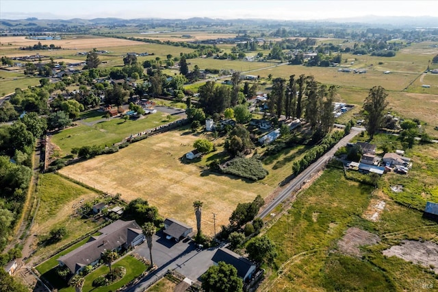 birds eye view of property with a rural view