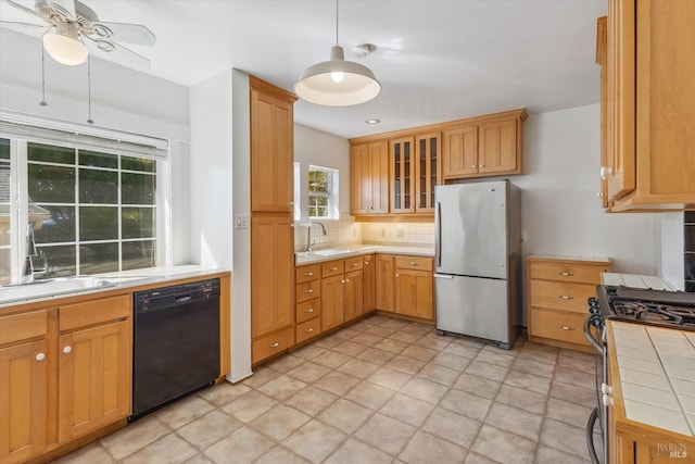 4344 Langner Ave, Santa Rosa, CA 95407 - kitchen with tile countertops, appliances with stainless steel finishes, a sink, and tasteful backsplash