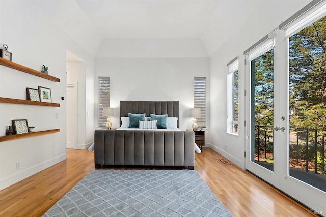 bedroom featuring access to outside and light hardwood / wood-style floors