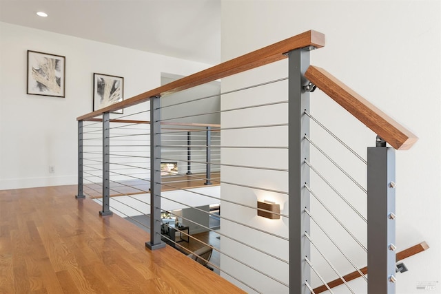 stairway featuring hardwood / wood-style floors