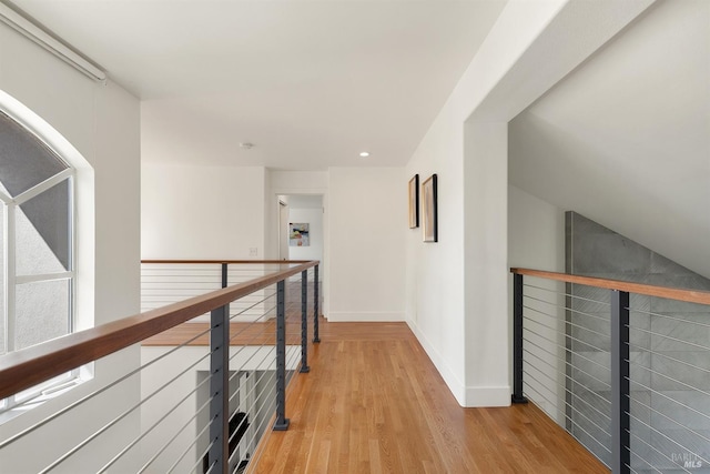 corridor with light hardwood / wood-style flooring