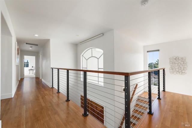 hall with wood-type flooring