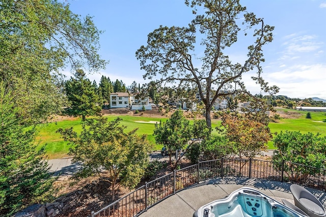 view of patio / terrace with a hot tub