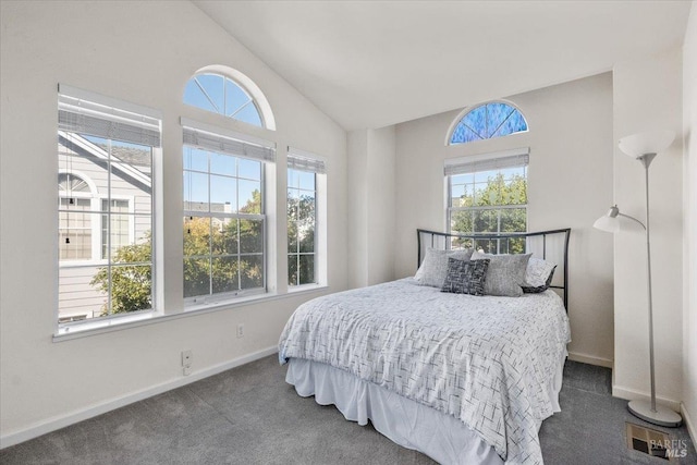 carpeted bedroom with vaulted ceiling