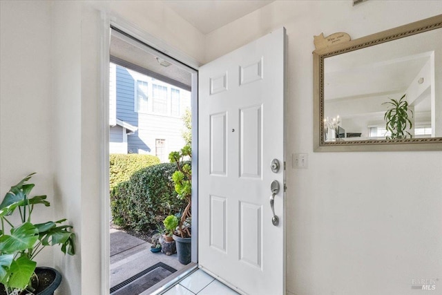 entrance foyer with light tile patterned floors