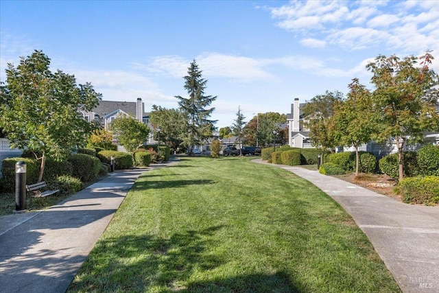 view of home's community featuring a lawn