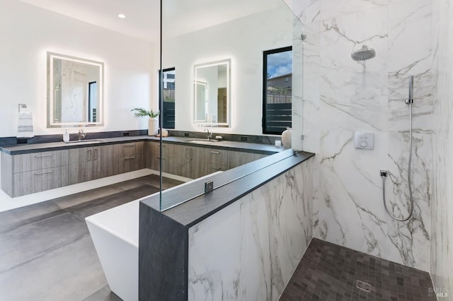 bathroom with vanity and separate shower and tub