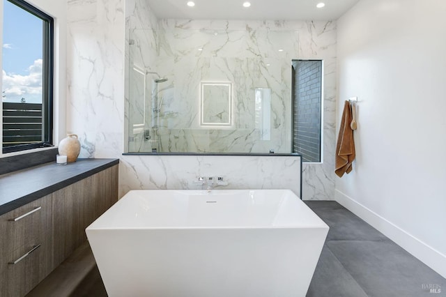 bathroom with vanity, separate shower and tub, and concrete flooring