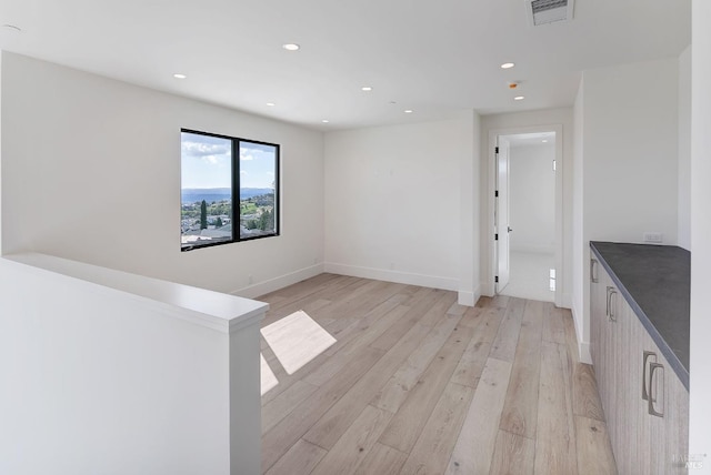 unfurnished room featuring light hardwood / wood-style floors