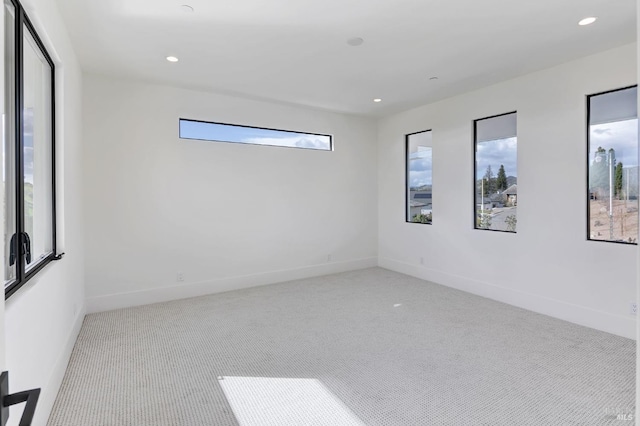 empty room featuring light colored carpet