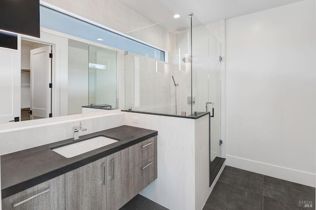 bathroom featuring tile patterned flooring, vanity, and an enclosed shower