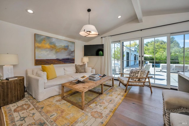 living room featuring french doors, vaulted ceiling with beams, and light wood-type flooring