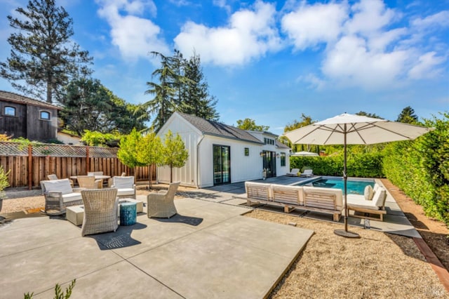 view of patio / terrace with a fenced in pool