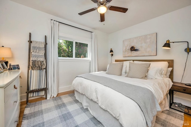 bedroom featuring ceiling fan and light hardwood / wood-style floors