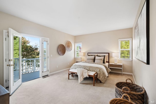 carpeted bedroom with access to outside