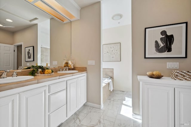 bathroom featuring a bath and vanity