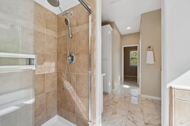 bathroom with a tile shower