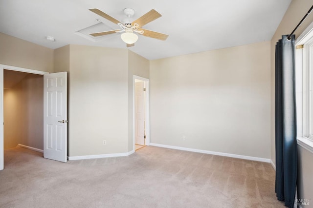 unfurnished bedroom featuring ceiling fan and light carpet