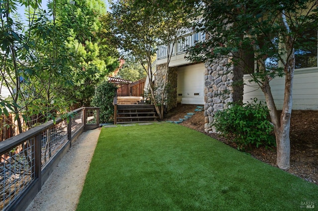 view of yard featuring a balcony