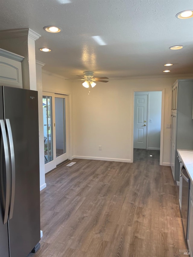 kitchen featuring recessed lighting, a ceiling fan, dark wood-style floors, and stainless steel appliances
