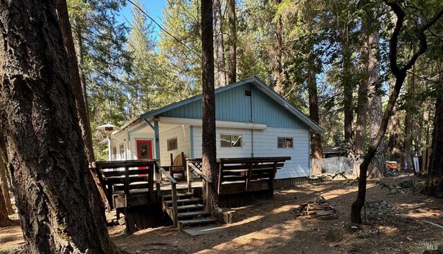 back of property featuring a deck