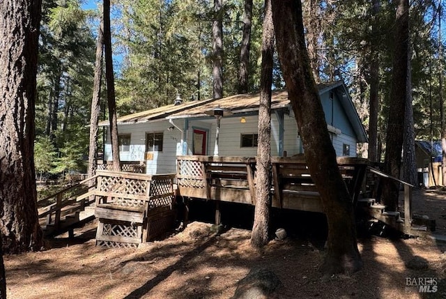 rear view of house with a wooden deck