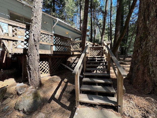 exterior space featuring stairs and a deck