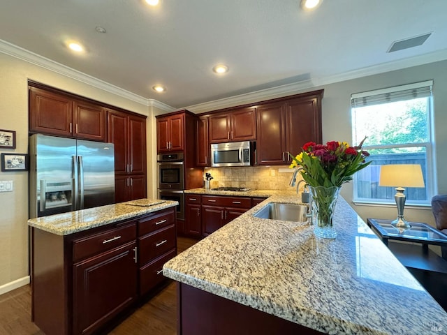 kitchen with decorative backsplash, ornamental molding, stainless steel appliances, sink, and dark hardwood / wood-style floors