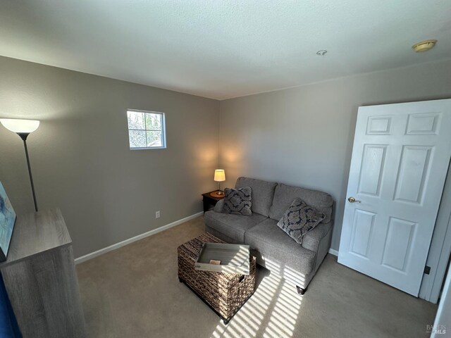 washroom with washing machine and clothes dryer, light tile patterned floors, cabinets, and a textured ceiling