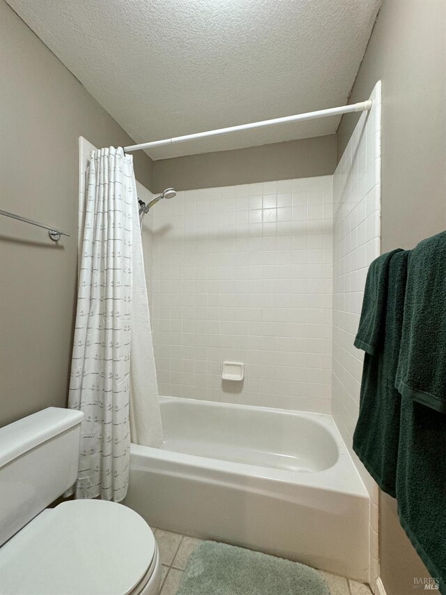 bedroom featuring a tray ceiling, connected bathroom, light carpet, and ornamental molding