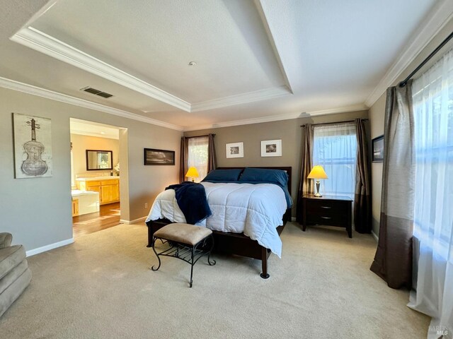 bathroom featuring wood-type flooring, crown molding, and a healthy amount of sunlight