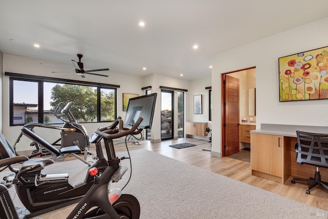 workout room featuring ceiling fan, light wood-style flooring, and recessed lighting