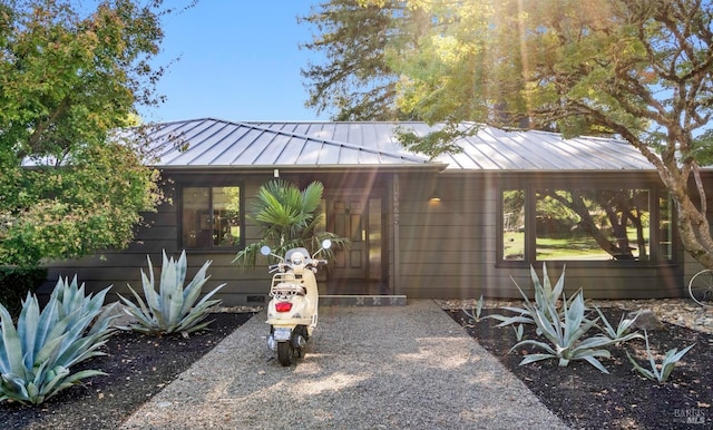 view of front of property featuring a standing seam roof and metal roof